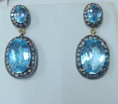 Gorgeous Vintage 14k white diamond blue topaz drop earrings. set four natural blue topaz oval shape size 16x11mm and 8x6mm very clean, very nice cut, very brilliant. Nice sky blue color.  side set natural champagne diamonds weigh 1.55ct.SI2  A gorgeous pair of earrings!  1.5 inches long  very nice make, beautiful setting,  old earrings in  very good condition  Appraisal avail Old Earrings, Emerald Style, Sky Blue Color, Sky Blue Topaz, Champagne Diamond, Diamond Solitaire Rings, One Ring, Gold Drop Earrings, Diamond Solitaire