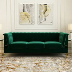 a living room with two paintings on the wall and a green couch in front of it