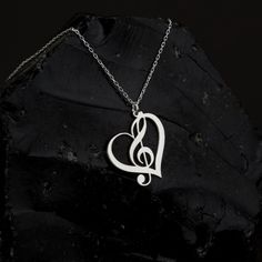 "Treble Clef Necklace in Sterling Silver is made by hand in our workshop with care. All our jewelry is the most elegant choice for the Bridesmaids, friends, your loved ones and for yourself. Treble Clef Necklace in Sterling Silver * Material: High Quality Solid 925 Sterling Silver. * Dimensions: Depending on your font choice, height sizes range from 1,5 mm to 3,5 mm lowercase. * Finish: Sterling Silver ∙ Gold ∙ Rose Gold. HOW TO ORDER ❓ * Select your necklace COLOR. * Choose necklace length from Heart-shaped Music-themed Jewelry Gift, Music-themed Heart-shaped Jewelry Gift, Silver Heart-shaped Music-themed Jewelry, Music-themed Silver Heart Jewelry, Music-themed Jewelry For Valentine's Day Gift, Music Aesthetics, Treble Clef Necklace, Gift For Musician, Musical Jewelry