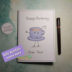 a birthday card with an image of a coffee cup on it and a pen next to it