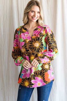 This collarless top features long bubble sleeves, a lightweight construction, and an all-over floral print. Crafted from 100% Polyester, Model is 5'8'' and wearing a Small. Imported by Jodifl. Chic Floral Print Top With Split Neck, Spring Multicolor Print Long Sleeve Blouse, Multicolor Puff Sleeve Blouse For Spring, Spring Long-sleeve Multicolor Print Blouse, Spring Multicolor Puff Sleeve Blouse, Pink Floral Print Blouse With Split Neck, Multicolor Printed Lantern Sleeve Blouse, Pink Floral Print Split Neck Blouse, Multicolor Lantern Sleeve Printed Blouse