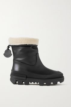 Moncler's 'Moscova' boots are made from supple black leather with faux fur trims that are sure to keep your feet warm during the colder months. They sit on 65mm rubber soles that have grips on the bottom to keep you from sliding. Wear them with cropped denim or leggings. Moncler Boots Woman, Black Leather Boots With Fur, Luxury Leather Boots With Faux Fur Trim, Luxury Winter Boots With Faux Fur Trim, Luxury Black Mid-calf Boots With Lug Sole, Moncler Women, Shoes Boots Ankle, Cropped Denim, Fur Trim