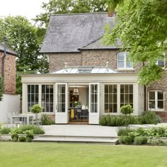 a house with an enclosed patio and dining area