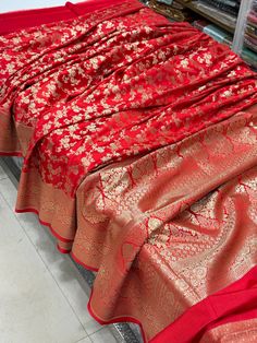 This Red Banarasi Silk Jaal Saree is expertly crafted with a classic and elegant weave, showcasing a perfect red shade that is ideal for any traditional occasion. Made from high-quality Banarasi silk, this saree exudes sophistication and style. Elevate your wardrobe with this stunning piece. Bridal Anklet, Dress Book, Stylish Dress Book, Stylish Dresses, Labour Day, Bathing Beauties, Saree, Display Homes, India