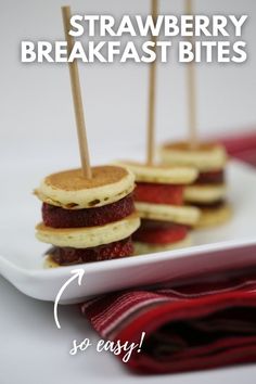 strawberry breakfast bites on a plate with toothpicks sticking out of the top one