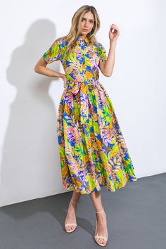 Indulge in the opulent sophistication of our printed woven midi skirt dress, adorned with cuffed short sleeves, a button-down front, and a self sash tie.Details:Self : 100% CottonSize & Fit- Model is 5`8" And Wearing Size Small- Measurements Taken From Size Small- Approx. Length: 49" Chic Short Sleeve Maxi Dress With Tie Waist, Belted Midi Dress With Short Sleeves For Casual Wear, Short Sleeve Belted Midi Dress For Casual Wear, Casual Belted Midi Dress With Short Sleeves, Casual Belted Short Sleeve Midi Dress, Midi Shirt Dress With Tie Waist For Day Out, Spring Short-sleeve Printed Maxi Dress, Spring Printed Maxi Dress With Short Sleeves, Spring Printed Short Sleeve Maxi Dress