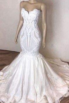 a mannequin wearing a white wedding dress