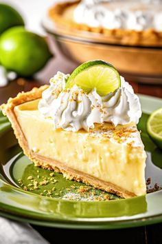 a slice of key lime pie on a green plate with two limes in the background