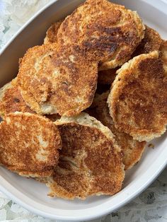 some fried food in a white bowl on a table