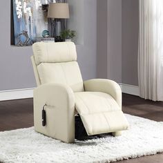 a white recliner chair sitting on top of a rug