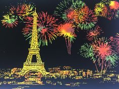 the eiffel tower is lit up with fireworks