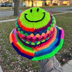 Fun, random, and full of color. There is not set pattern for this hat but you are guaranteed to get a rainbow of colors. Each hat has a yellow smiley face on the top. Adult size (about 15cm diameter, 7.5cm crown depth, 2.5cm brim depth) Hat will stretch to fit head. PLEASE NOTE: Fit will vary depending on the size and shape of your head. IMPORTANT: I have cats and unfortunately their hair gets on everything I own including yarn. I try my best to keep it away from them but it's not 100% Smiley Face Crochet, Rainbow Bucket Hat, Please Be Patient With Me, Everything I Own, Yellow Smiley Face, Be Patient With Me, Set Patterns, Quality Hats, Shape Of You