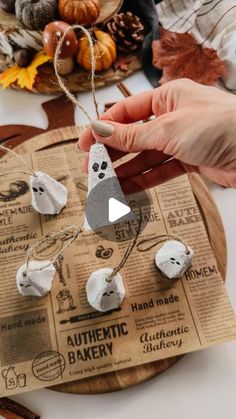 someone is making an ornament out of toilet paper and other items on a table