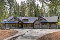 a large house in the woods with lots of trees