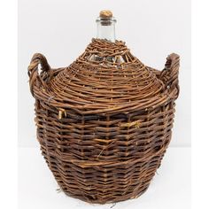 an empty wicker basket with a bottle in the top and bottom, on a white background