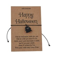 a card that says happy halloween with a black ghost head on the front and bottom