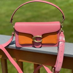 Polished Pebble Leather Inside Zip And Multifunction Pockets Snap Closure, Fabric Lining Outside Slip Pocket Detachable Short Strap With 7 3/4" Drop Detachable Long Strap With 21 1/4" Drop For Shoulder Or Crossbody Wear 10 1/4" (L) X 6" (H) X 3" (W) Coach Color Block Purse, Designer Pink Flap Shoulder Bag, Designer Pink Shoulder Flap Bag, Designer Pink Flap Bag With Detachable Strap, Designer Pink Crossbody Flap Bag, Pink Satchel Flap Bag With Detachable Strap, Pink Top Handle Flap Bag With Detachable Handle, Pink Rectangular Satchel With Detachable Strap, Pink Square Flap Bag For Shopping