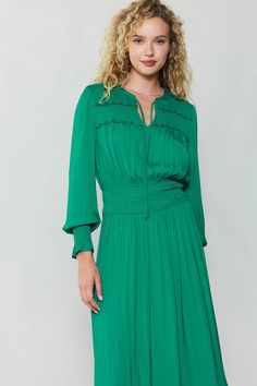 Done in a vibrant green, this long-sleeve V-neck midi dress is a vision of sophistication and femininity. The tie-up neckline and ruffle trim add to the allure, and the smocked peplum creates definition at the waist. This one will become a fast favorite. •Relaxed fit •V-neck with tie detail •Ruffle trim •Elasticized waist •Long sleeves •Mid-length hem DIMENSIONS •Standard: 49" Length Item number 1990036CA100% Polyester Gentle cycle cold water Green Ruched Midi Dress For Fall, Green Dresses With Elastic Sleeves For Fall, Elegant Long Sleeve Smocked Dress With Elastic Sleeves, Green Dress With Elastic Sleeves For Fall, Green Fall Dress With Elastic Sleeves, Elegant Green Dress With Gathered Neckline, Green Ruched Maxi Dress For Fall, Green Ruffled Midi Dress For Work, Green Midi Dress With Ruffles For Work