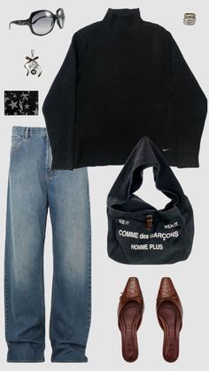 a black sweater, jeans and brown shoes are arranged in the shape of a man's outfit