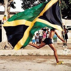 a man running with a flag in his hand and the words sprint nation on it