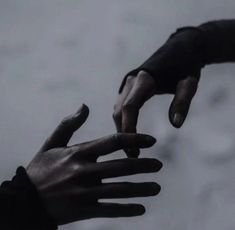 two hands reaching out towards each other