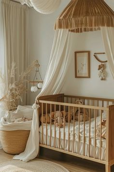 a baby's room with a canopy bed and white drapes