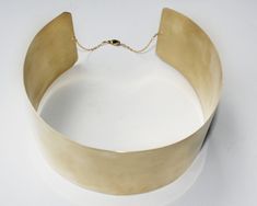 "Similar in design to my Ankle Cuffs, available in the link below, this 2\" choker is a bold and chic design that adds A LOT of oomph to your look. The gold tone choker looks great on any complexion and is an eye-catching statement piece that anyone can pull off! Readily available sizes are Small (14\"), Medium (15\") and Large (16\") although I TAKE CUSTOM ORDERS so feel free to request a specific size/measurement. A metal choker can be uncomfortable so I keep them easy to wear with very mallea Formal Brass Choker, Be Uncomfortable, Metal Choker, Choker Gold, Gold Choker, Wrist Cuffs, Ankle Cuffs, Pull Off, Choker Necklaces