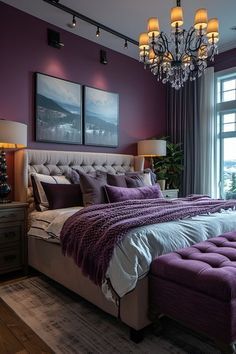 a bedroom with purple walls and a large bed in the middle, along with a chandelier hanging from the ceiling