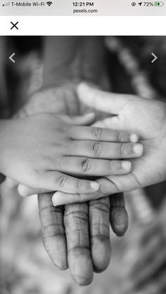 two hands holding each other in black and white