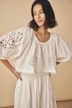 The Daisy blouse exudes understated charm with a hint of playful elegance. This scoop neckline blouse embodies subtle sophistication with its cropped profile and graceful elbow-length raglan sleeves. What sets Daisy apart is the meticulous attention to detail—featuring delightful bobble trim at the hem and intricate eyelet embroidery throughout. Scoop Neckline Blouse, Embroidery Shorts, Daisy Top, Hunter Bell, Eyelet Embroidery, Eyelet Top, Vintage Denim Jacket, Sea Star, Satin Mini Dress