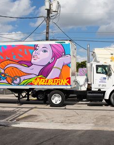 a white truck with a painting on the side