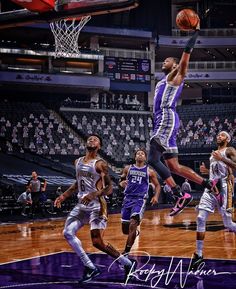 an image of a basketball game going on in the air