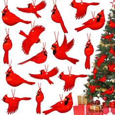 a christmas tree with many red birds hanging from it