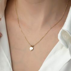 Tria Mini Heart Necklace, 14k Gold Necklace, Gold Necklaces, Gift Necklace, Necklace for Women Gift, Necklace for Mom ITEM DETAILS ❆ All our jewelleries are handmade with Love and Care 💓 ❆ Material: 14K Gold. ❆ Gram: 1,74 gr ❆ Each item is made to order. Since all of our products are handmade, there may be -) 10% deviation in the specified weight. ❆ DO YOU LIKE THIS RING? You can get more information about it below but if you have any questions, just send a message. PACKAGING ❆ They are sent in Classic Heart-shaped Birthstone Necklace, Elegant Heart Cut Necklace With Charms, Classic Heart Pendant Necklace With Birthstone, 14k Gold Heart Charm Necklace For Wedding, Tarnish Resistant Heart Pendant Necklaces For Mother's Day, 14k Gold Necklace With Heart Charm And Cut, Tarnish Resistant Heart Cut Necklace For Gift, Tarnish Resistant Heart Cut Heart Necklace For Gift, 14k Gold Charm Necklace With Heart And Initial Pendant