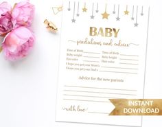 a baby shower game with pink flowers and gold foil stars on the top, next to it