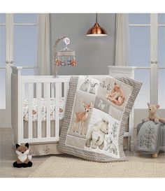 a baby crib with two stuffed animals next to it and a teddy bear on the floor