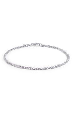 A sterling silver bracelet features a twisted rope design for textural flair. 7" length Clasp closure Sterling silver Imported Silver Tennis Bracelet With Chain Link, Silver Chain Link Jubilee Tennis Bracelet, Elegant Twisted Silver Bracelets, Elegant Silver Twisted Bracelet, Classic Silver Wheat Chain Bracelet, Silver Adjustable Twisted Bracelets, Silver Bracelets With Curb Chain, Adjustable Twisted Silver Bracelets, Elegant Bracelets With Rope Chain And Link Shape