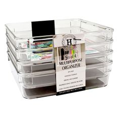 three clear storage containers with labels on them