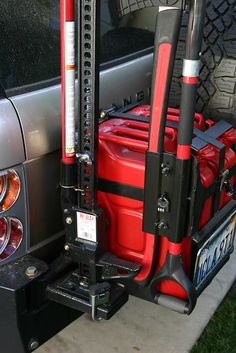 the back end of a car with luggage strapped to it