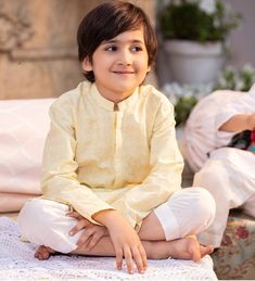 1 Piece - Kurta Shalwar (2 Piece) Dress up your little one in this dashing yellow schiffli embroidered cambric kurta for Boys. Details : Shirt : Yellow schiffli embroidered cambric shirt. White Bottoms Country of Origin : Pakistan Care Instruction : Should be washed in gentle cycle and hung to dry. Color may bleed so please be mindful of other items with it. Disclaimer : Size chart provides reference sizes and actual sizes might be slightly different from the size chart. Actual colors of the outfit may vary from the colors being displayed on the screen. Long Sleeve Yellow Kurta For Eid, Yellow Long Sleeve Kurta For Eid, Yellow Cotton Kurta With Dabka, Yellow Cotton Kurta With Dabka Detail, Yellow Festive Kurta For Eid, Yellow Kurta For Festive Occasion And Eid, Festive Yellow Kurta For Eid, Yellow Cotton Kurta With Dabka Embroidery, Yellow Self Design Set For Eid