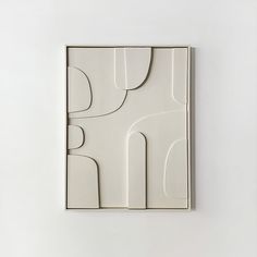 a white box with an abstract design on it