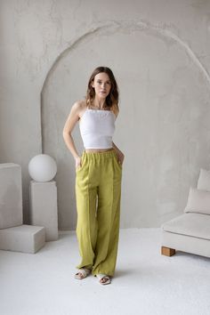 "✈    FREE WORLDWIDE EXPRESS DELIVERY FOR ALL ORDERS OVER 100 EUR (except for remote areas and Australia)! 🎁  FREE tea towel gift for all orders over 100 EUR value! Lime Green Wide Leg Linen Woman Pants / High Waisted Creased Linen Pants These simple and cozy linen pants are made of high-quality, pure, and natural European linen. This handmade and sustainable item is softened and looks better and better with age and every wash.  * 100% pure and natural medium-weight European linen * stonewashed * breathable, anti-allergic, anti-static * light, very durable and strong * Easy to wash * OEKO-TEX® Standard 100 certified  Piece of nature in your home  Available sizes: * XS Waist: 60 - 64 cm / 23.6\" - 25.1\" Hips: 88 - 92 / 34.6\" - 36.2\" * S Waist: 64 - 70 cm / 25.1\" - 27.5\" Hips: 92 - 98 Linen Summer Pants, Green Trousers Outfit, Lime Green Pants, Green Linen Pants, Summer Linen Pants, Green Linen Dress, Linen Dress Pants, Dress Pants Outfits, Woman Pants