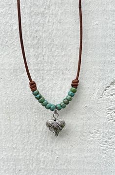 Turquoise Heart Necklace  I've used Genuine vintage Brown Leather Cord 1.5 mm Small Silver Heart Bead 14mm Turquoise Picasso Seed Beads Necklace is shown in brown leather. This Necklace is made with Miyuki Seed Beads, which are very high quality Japanese beads. This is a representation of the exact Choker you will receive. All designs are hand made, as I do my best to make them perfect for you, and are created with love and joy. Your New Treasure will arrive gift wrapped whether you are buying i Heart Beaded Necklace, Turquoise Heart Necklace, Leather Cord Jewelry, Leather Jewelry Making, Leather Jewelry Diy, Leather Heart, Rope Jewelry, Choker Jewelry, Cord Jewelry