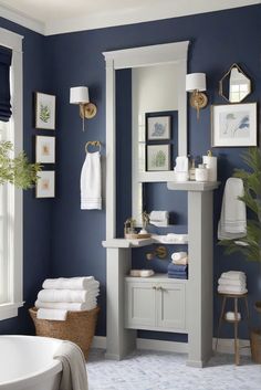 a bathroom with blue walls and white fixtures