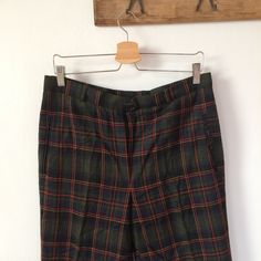 Such a classy vintage 90's wool Tartan check wool pants. Material:100% wool Measurements: waist:16,5" hip:21,5" inseam:28" outseam:38,5" rise:12" Very good condition. Vintage Plaid Pants For Fall, Classic Plaid Pants For Fall, Classic Plaid Bottoms With Welt Pockets, Vintage Plaid Pants For Work, Retro Fitted Wool Bottoms, Vintage Plaid Bottoms For Work, Retro Wool Bottoms For Fall, Formal Plaid Wide Leg Bottoms, Formal Plaid Bottoms For Fall