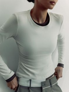 Basic longsleeve of a simple design featuring a round neckline and fitted long sleeves made from stretch jersey.- full length- fitted silhouette- round neckline- long sleeves Fitted Long Sleeve Top With Thumbholes Crew Neck, Long Sleeve Tops With Thumbholes And Minimal Stretch, Fitted Long Sleeve Crew Neck Top For Layering, Long Sleeve Tops With Thumbholes, High Stretch Crew Neck Long Sleeve Top With Thumbholes, Long Sleeve Tops For Layering With Minimal Stretch, High Stretch Crew Neck Top With Thumbholes, Classic White Fitted Long Sleeve Top, Long Sleeve Top With Thumbholes And Minimal Stretch