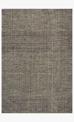 an area rug that is made out of woven material with grey and white squares on it