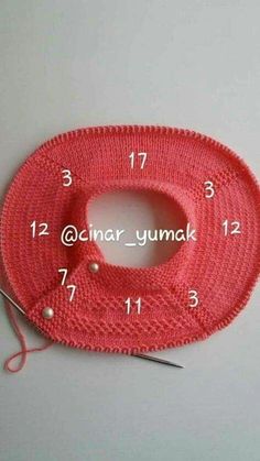 the instructions for making a crochet scarf with yarn and scissors on top of it