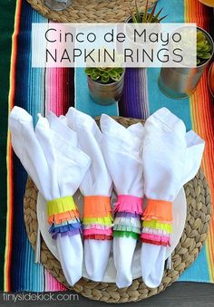 cinco de mayo napkin rings are on a plate with other dishes and utensils