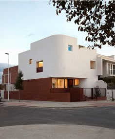 a large white building sitting on the side of a road